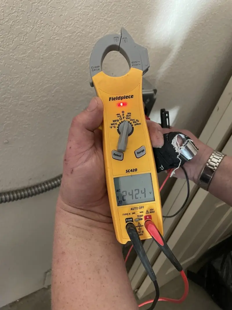 Voltage testing with clamp meter during Whole House Surge Protector in Willcox